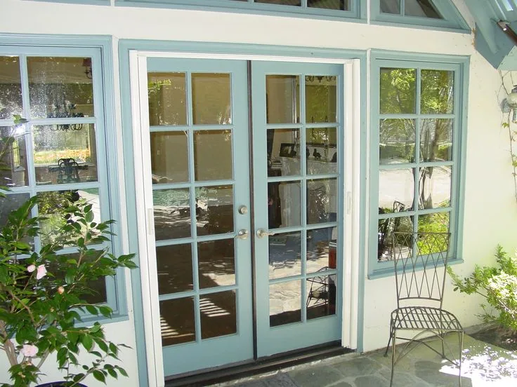 Detail of a retractable screen door housing mounted to the door jamb