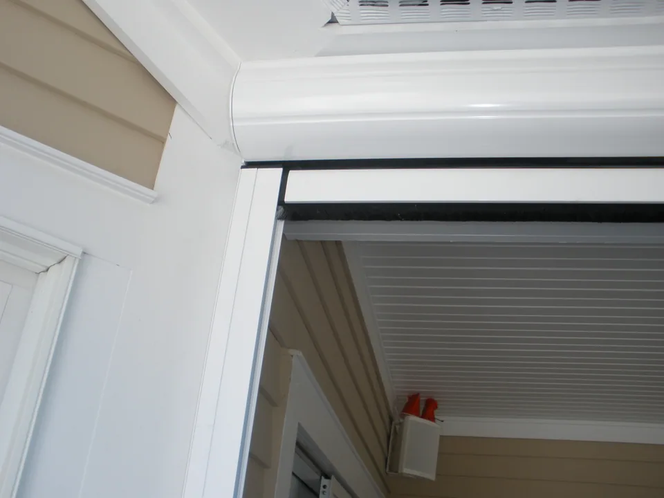 Retractable window screen drawn down over a window