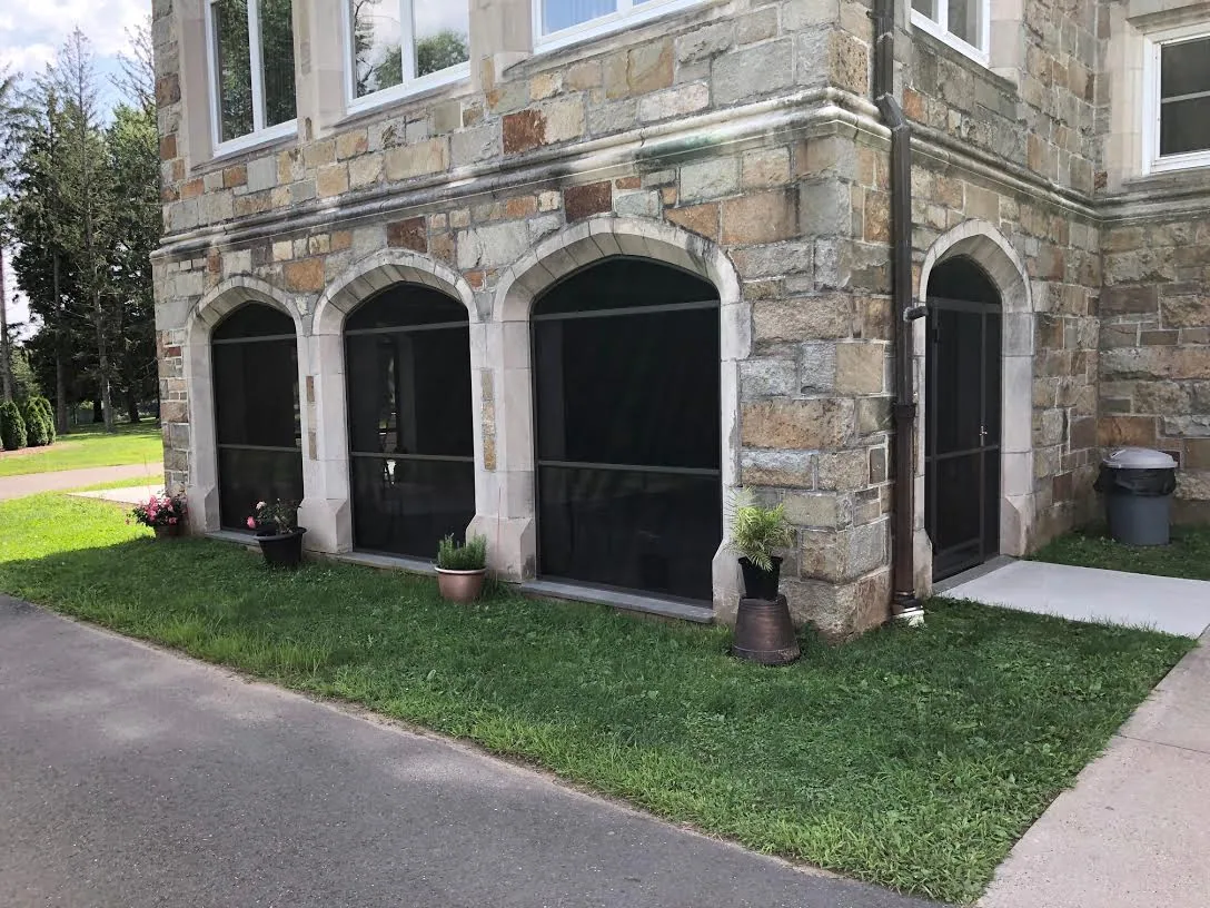 Completed Screen Wall System enclosure with custom arched tops on a Bloomfield, Connecticut home