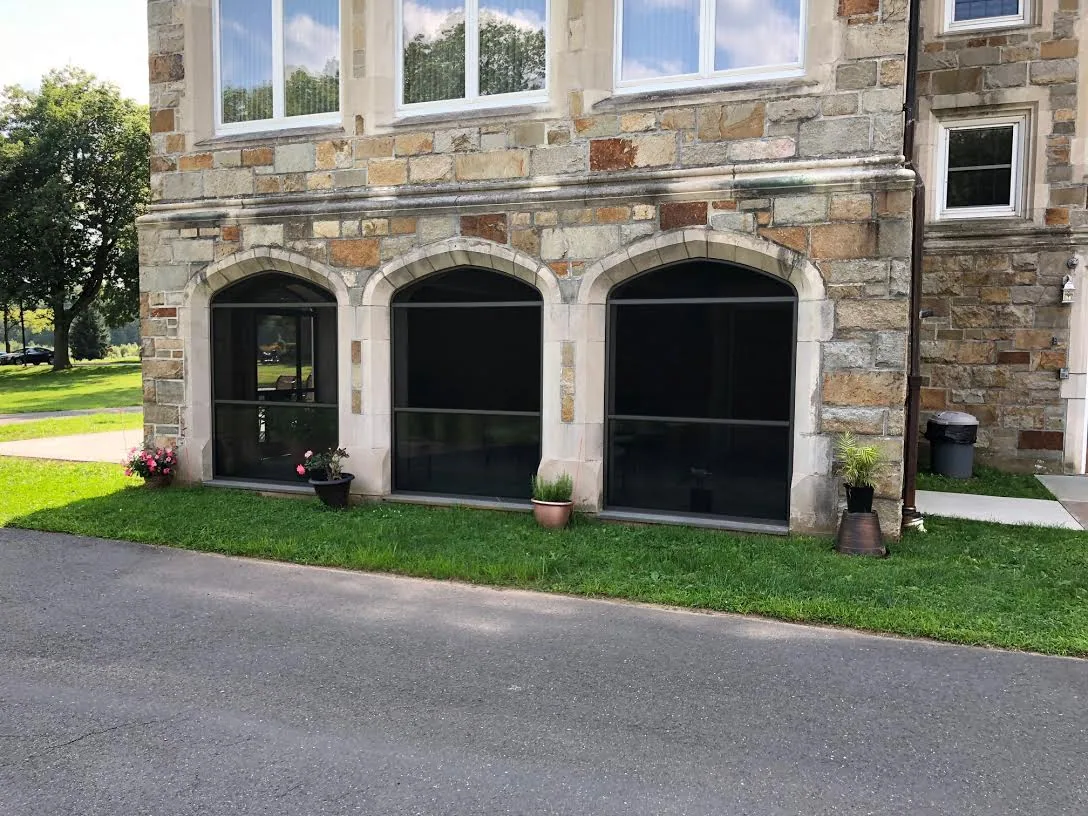 Screen Wall System enclosure with custom arched tops at a Bloomfield, Connecticut home, view 8