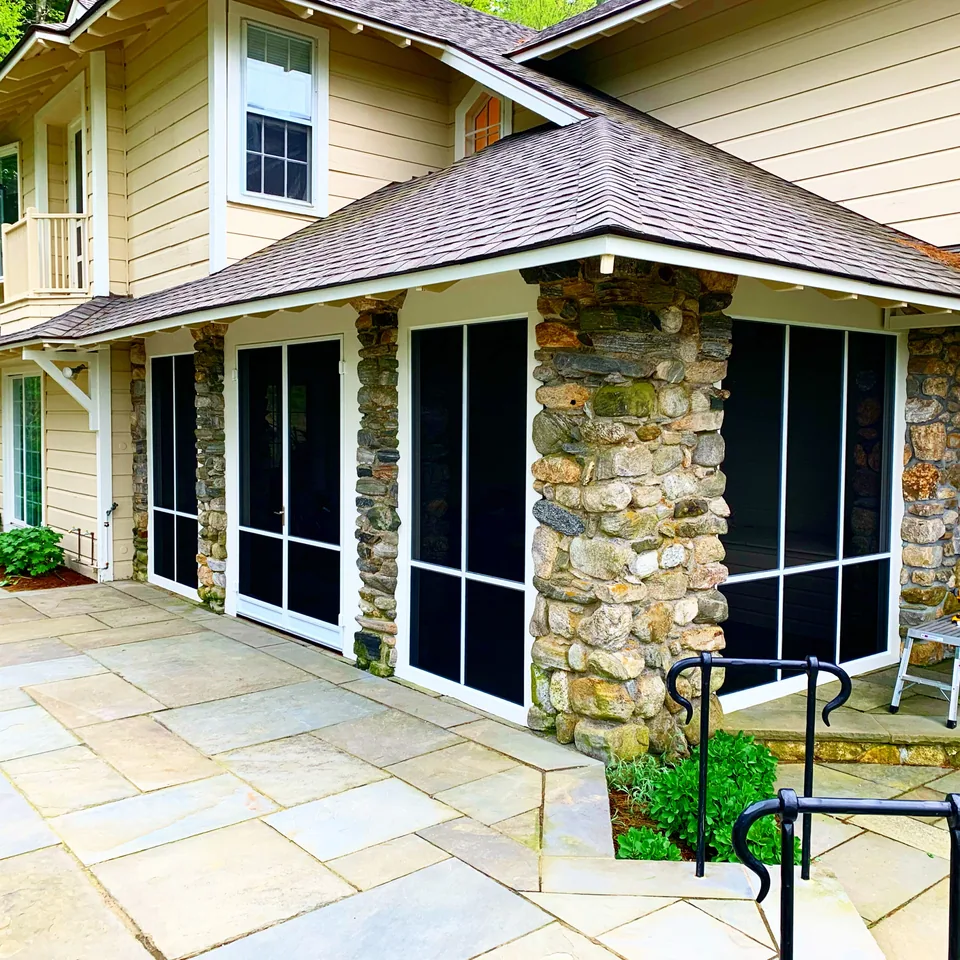 Screen Wall System enclosure spanning the rear elevation of a house