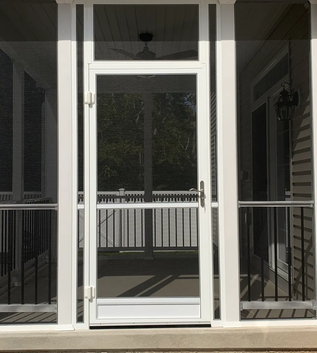 Screen Wall System door slab hung within a screen wall enclosure