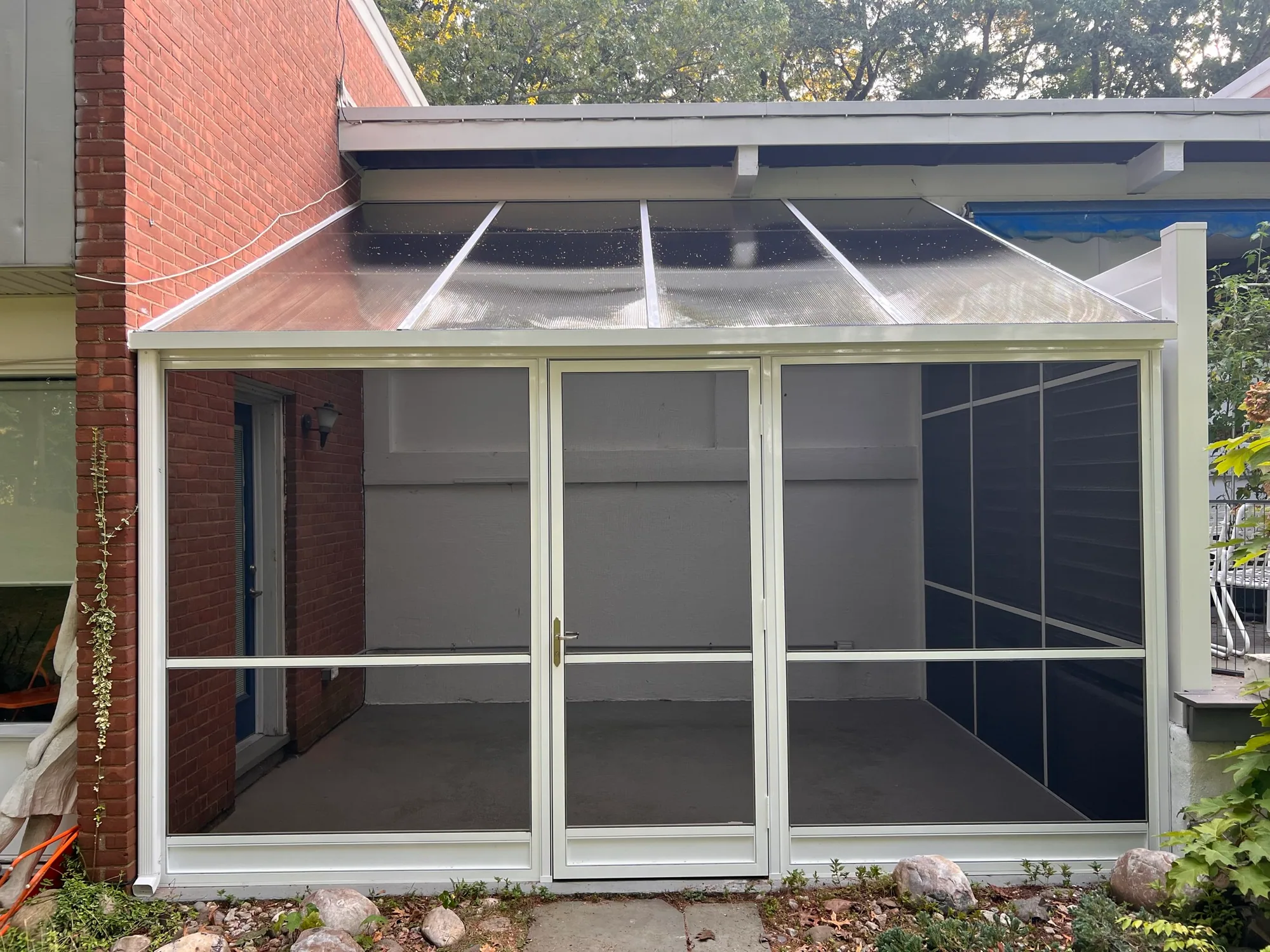 Raised deck screened in with aluminum screen panels