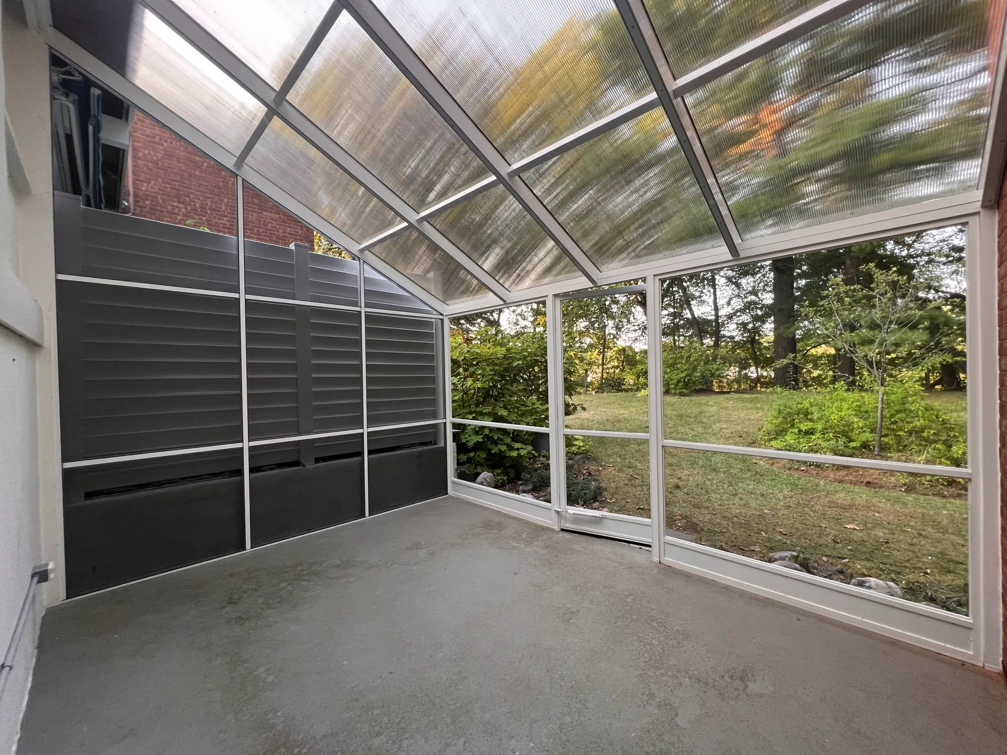 Finished screen enclosure viewed from the garden